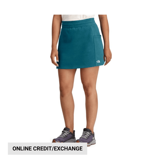 Teal athletic skirt with built-in shorts and a small logo at the hem