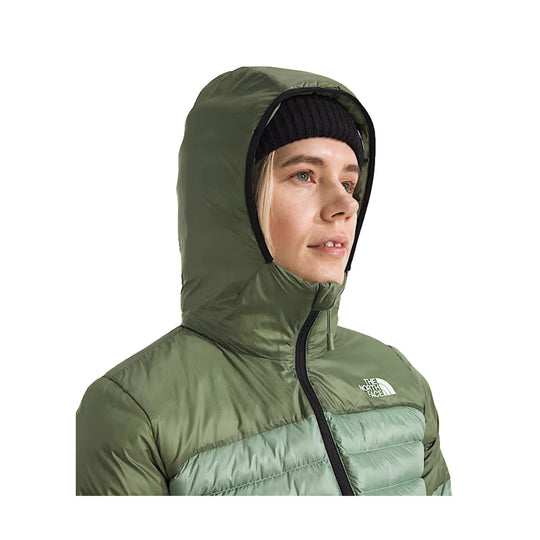 Olive hooded puffer jacket with mint quilted chest panels and black zipper, shown in side profile