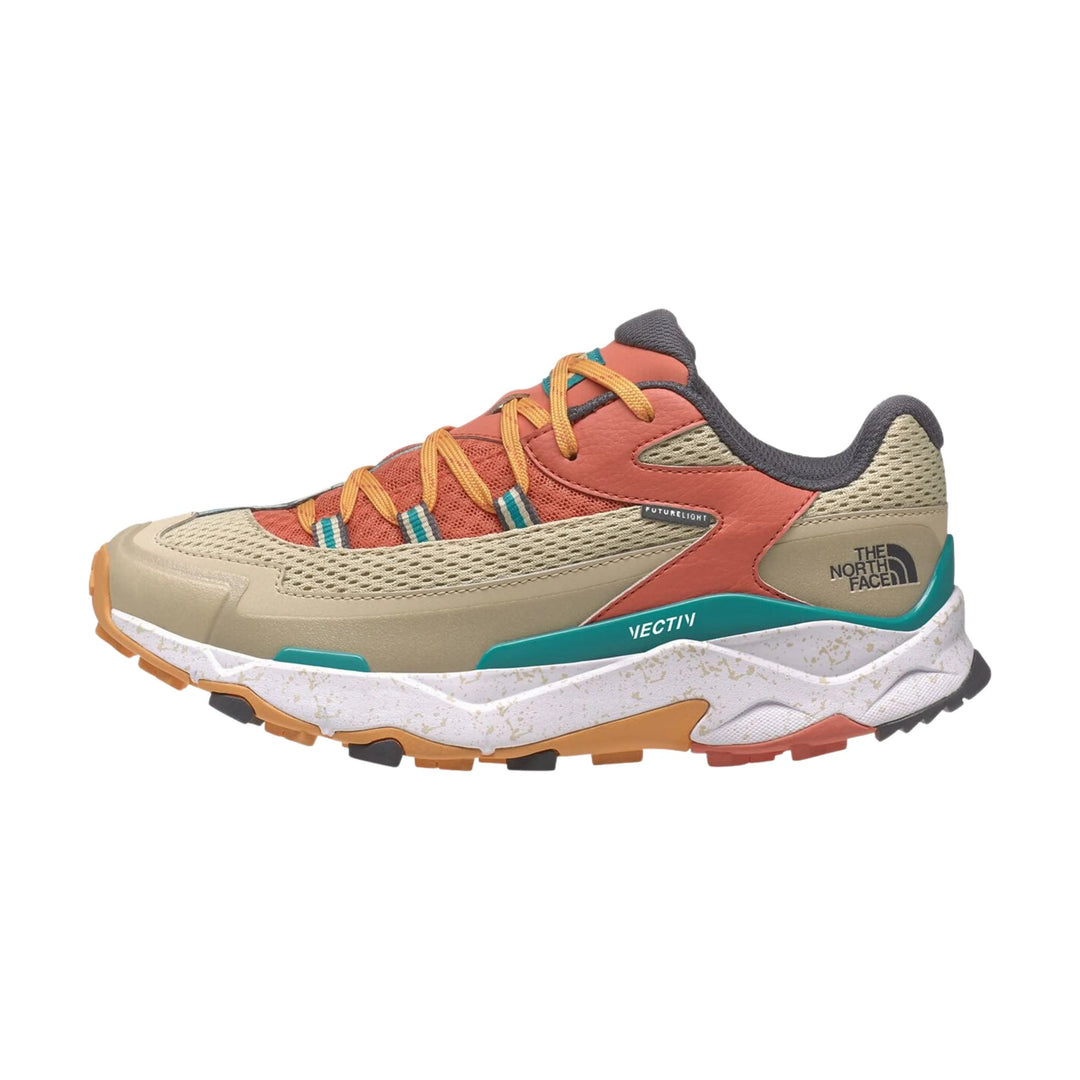 Low-top hiking shoe in tan, coral, and teal with mesh panels, yellow laces, and rugged tread