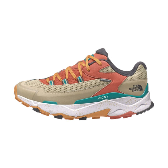 Low-top hiking shoe in tan, coral, and teal with mesh panels, yellow laces, and rugged tread