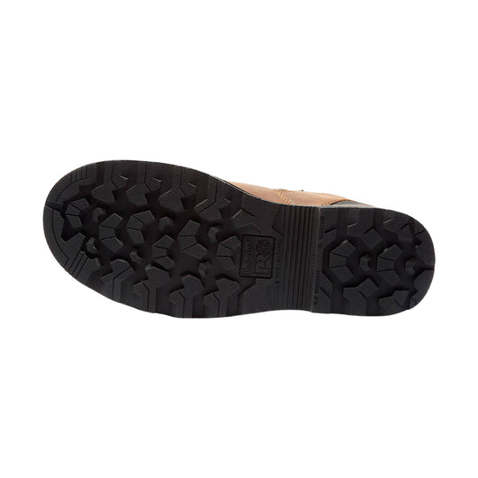 Black lugged work boot outsole with Timberland PRO branding and tan upper edge visible