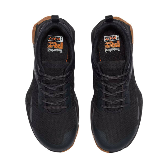Black low-top work shoes with gray laces, tan accents, and visible Timberland PRO 24/7 insole text