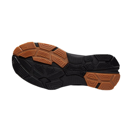 Black and brown lugged work shoe outsole with textured tread