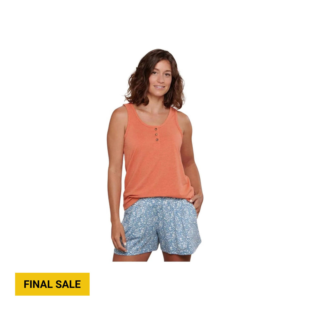 Coral sleeveless henley tank with three buttons, paired with blue patterned shorts