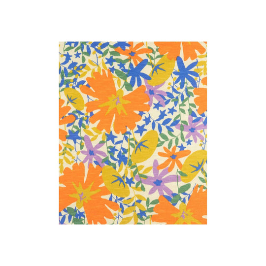 Floral print dress fabric in orange, blue, yellow, purple, and green