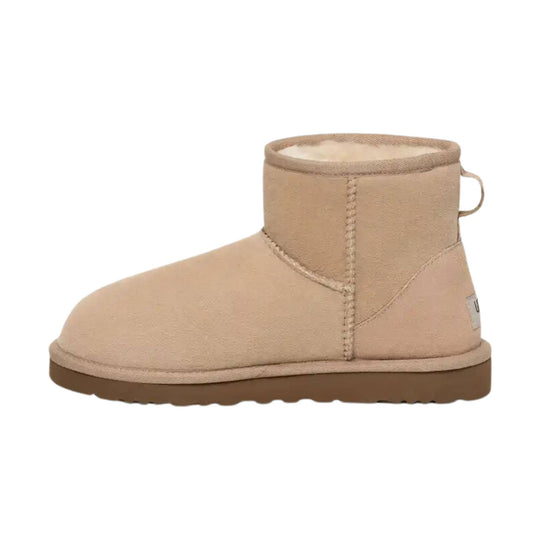 Tan suede ankle boot with a thick brown sole and stitched seam detail
