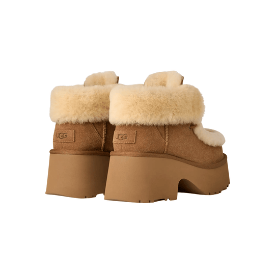 Tan shearling ankle boots with chunky platform soles and UGG logo patches