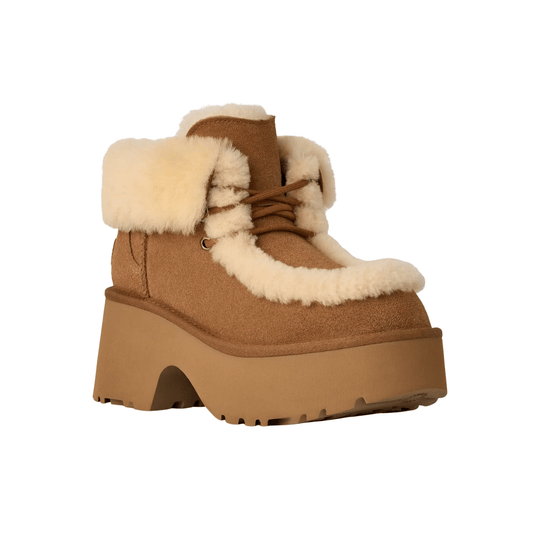 Tan lace-up winter boot with cream shearling trim and thick platform sole