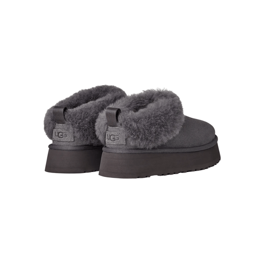 Pair of gray fuzzy slip-on slippers with thick platform soles and heel tabs