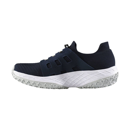 Navy athletic slip-on shoe with knit upper, side cutouts, and a white textured sole