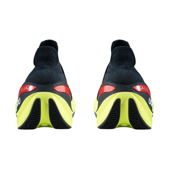 Pair of black knit running shoes with neon yellow heels and red heel accents, shown from the back.