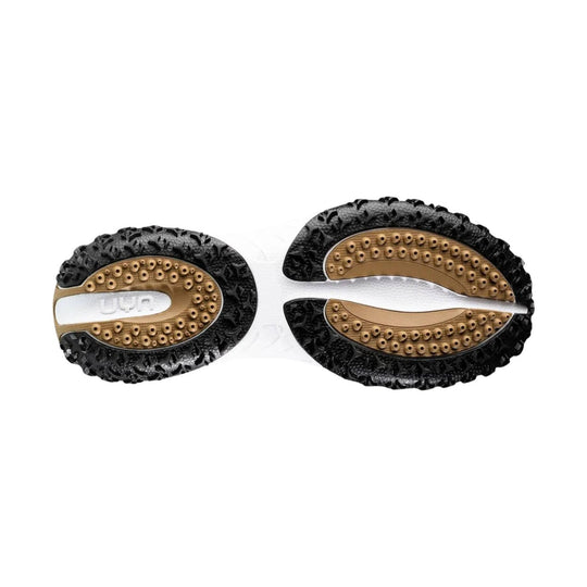 Pair of black and tan shoe soles with textured tread and visible UYN branding