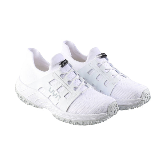 Pair of white lace-up athletic shoes with mesh uppers, side cutouts, and textured rubber outsoles