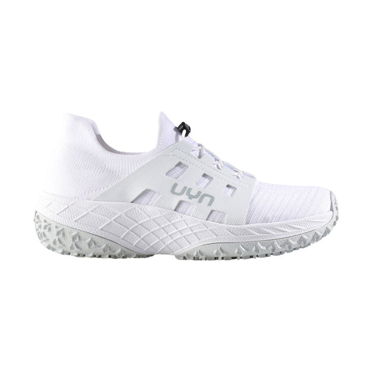 White low-top athletic shoe with knit upper, side cutouts, and rugged treaded sole