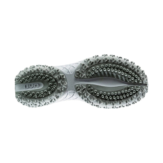 Gray treaded shoe sole with textured lugs and circular grip pods