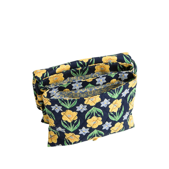 Quilted floral zip pouch with navy background, yellow flowers, and green leaves