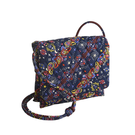 Quilted navy floral crossbody bag with a shoulder strap
