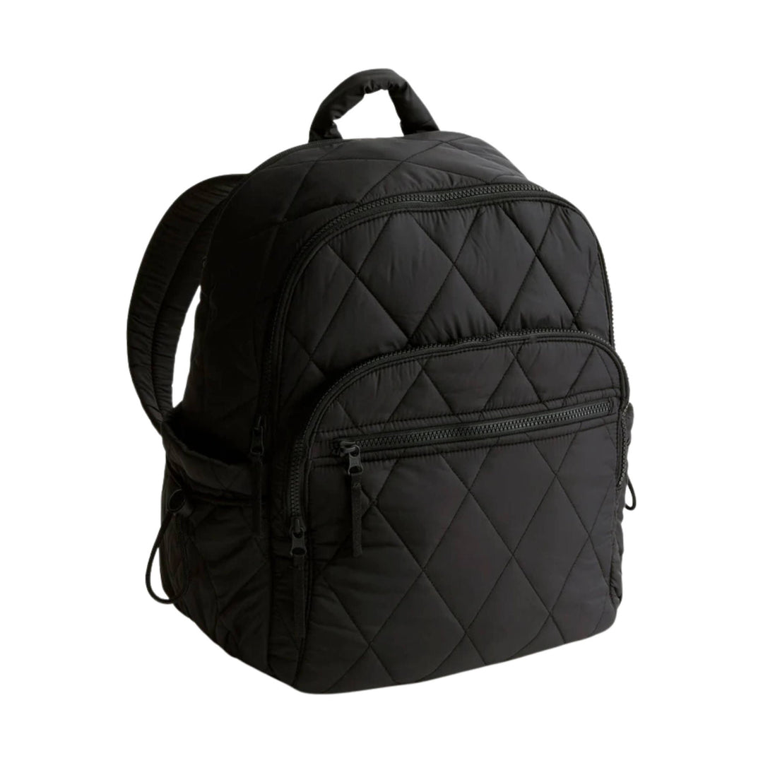 Black quilted backpack with top handle and multiple zippered front pockets