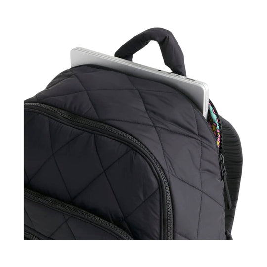 Black quilted backpack with a top handle and zippered front pockets, shown holding a laptop.