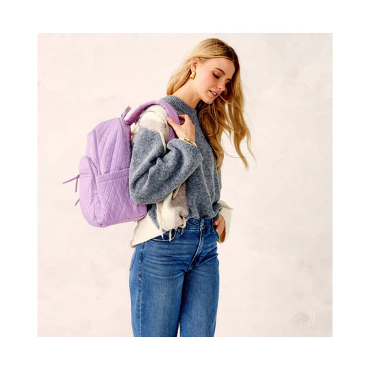 Light purple quilted backpack with side zipper pocket and top carry handle