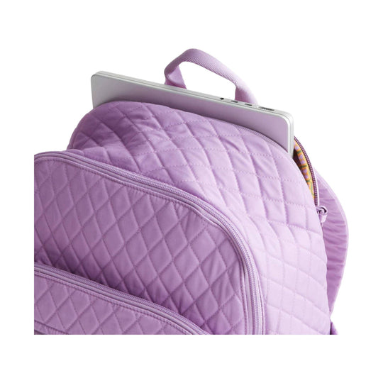 Quilted lavender backpack with a silver laptop in the main compartment