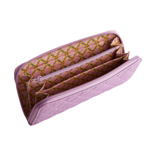 Pink quilted zip-around wallet with patterned fabric interior and multiple card slots