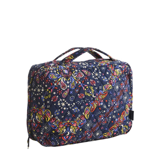 Quilted navy hanging travel organizer with colorful paisley and star print, zippered top, and two carry handles