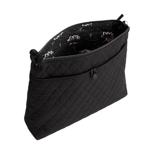 Black quilted zip pouch with floral patterned lining and front pocket
