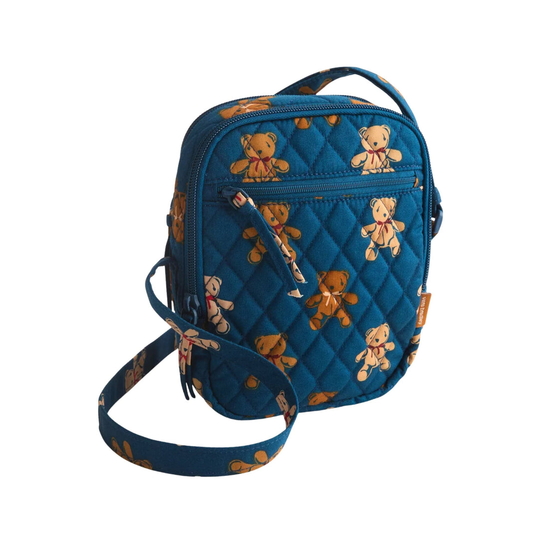 Blue quilted crossbody bag with teddy bear print, front zipper pocket, and shoulder strap