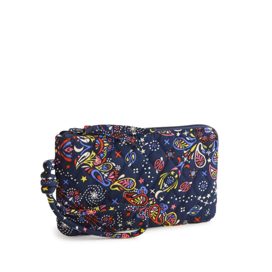 Navy quilted wristlet pouch with colorful paisley and star print