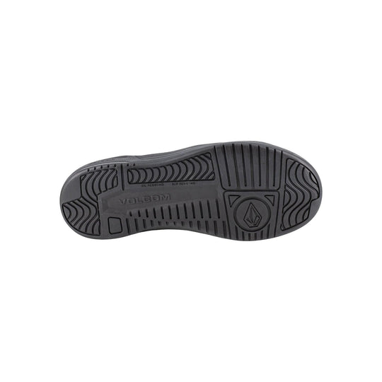 Black shoe outsole with deep tread and Volcom logo, marked oil resisting and slip resisting