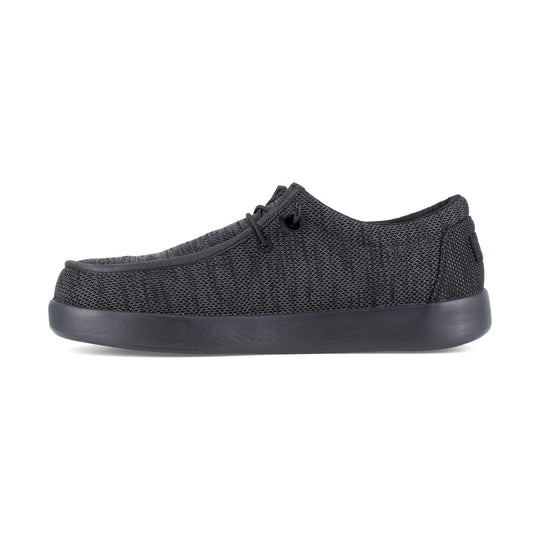 Black slip-on work shoe with a mesh upper, rounded toe, and thick rubber sole