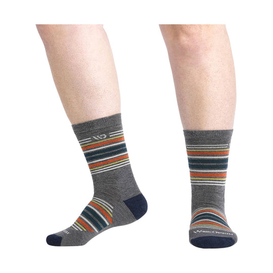 Gray crew socks with multicolor horizontal stripes, shown on a model's lower legs