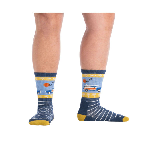 Pair of navy crew socks with yellow cuff, heel, and toe, showing a blue and yellow truck and sun pattern
