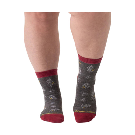 Dark gray micro crew socks with burgundy cuffs, toes, and heels on a model's legs.
