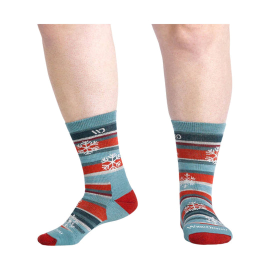Pair of patterned crew socks in light blue, red, and dark gray with snowflake motifs