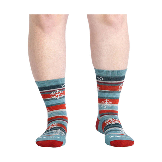 Pair of striped crew socks with snowflake patterns and teal toes and heels