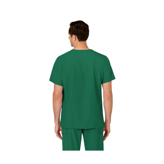 Back view of a green scrub top worn with matching scrub pants
