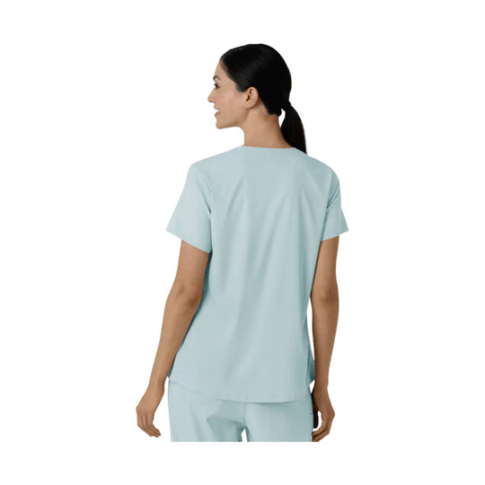 Light blue short-sleeve scrub top shown from the back