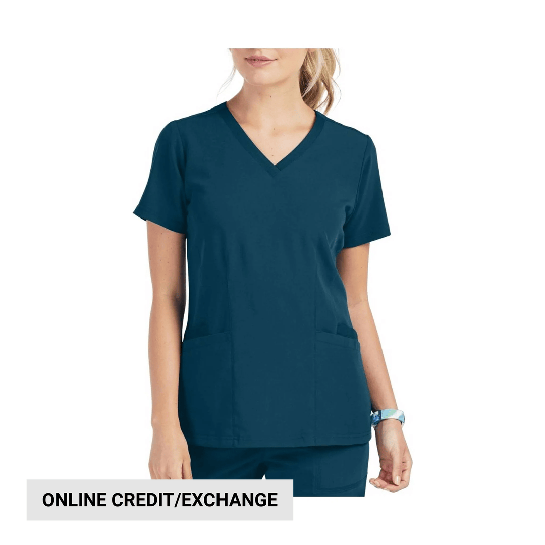 Teal V-neck scrub top with short sleeves and front patch pockets, shown on a model.