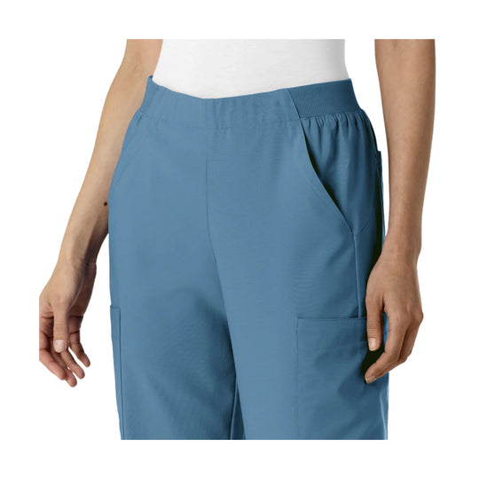 Blue high-waist cargo scrub pants with side pockets
