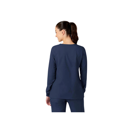 Navy long-sleeve scrub jacket shown from the back on a model