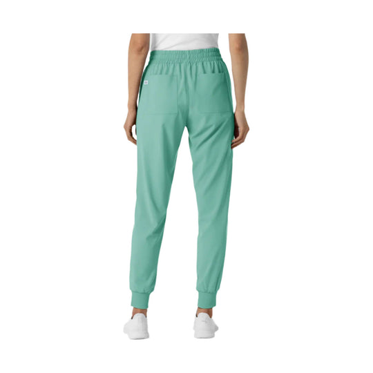 Mint green jogger scrub pants with an elastic waistband, patch pockets, and cuffed ankles