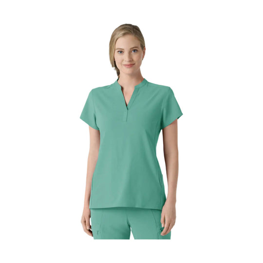 Turquoise V-neck scrub top with short sleeves and matching scrub pants