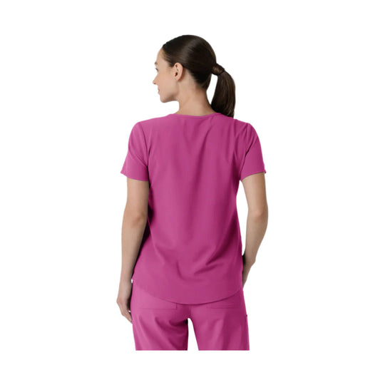 Pink short-sleeve scrub top shown from the back