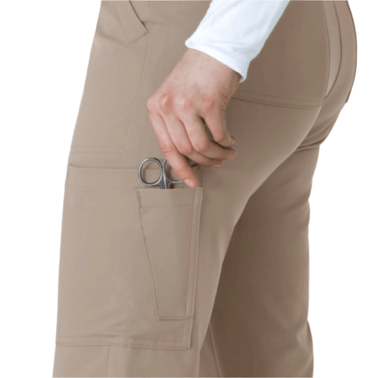 Beige cargo scrub pants with side pocket and scissors clipped in pocket
