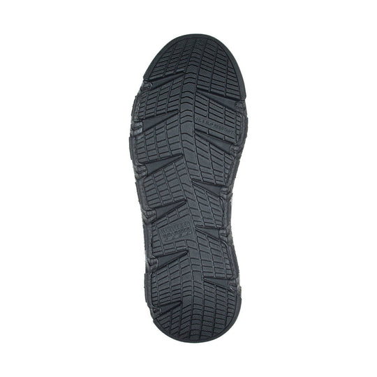 Black rugged shoe outsole with deep tread and side traction lugs