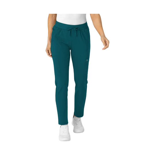 Teal women's scrub pants with elastic drawstring waist, side cargo pockets, and tapered legs