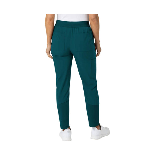 Teal women’s scrub pants with elastic waistband and cargo pockets, shown from the back