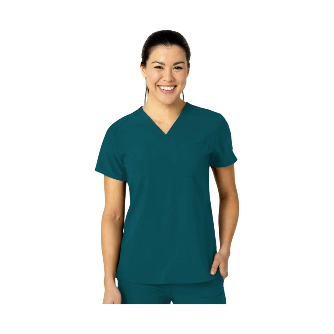 Teal V-neck scrub top with short sleeves and chest pocket, shown on a model